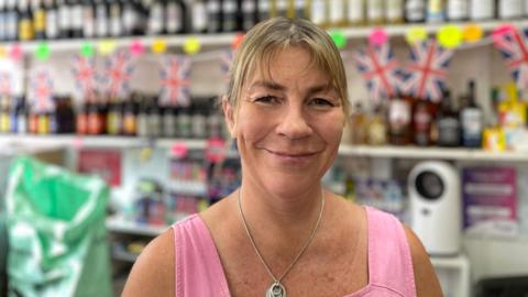 Amy Young owns the post office and village store