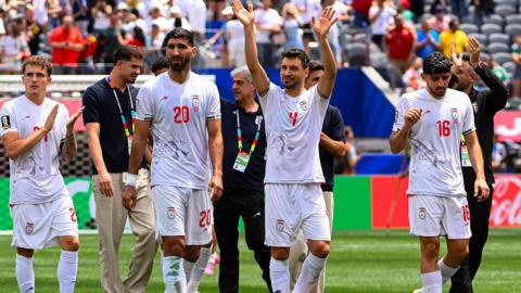Iran players applaud their fans at the Los Angeles Stadium