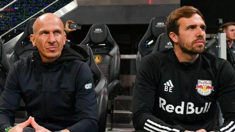 A photo of Gerhard Struber and Bernd Eibler sitting next to each other during a New York Red Bulls game