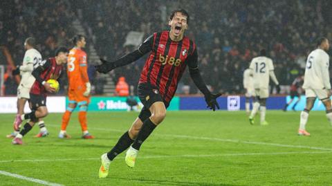 Enes Unal celebrates scoring an equaliser for Bournemouth against West Ham