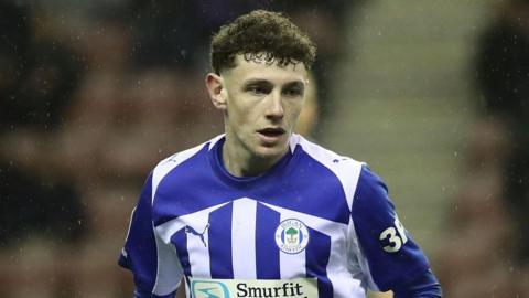 Harrison Bettoni looking concentrated while playing for Wigan