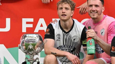 Gateshead captain Greg Olley celebrating with a team-mate after his side's FA Trophy final win in May