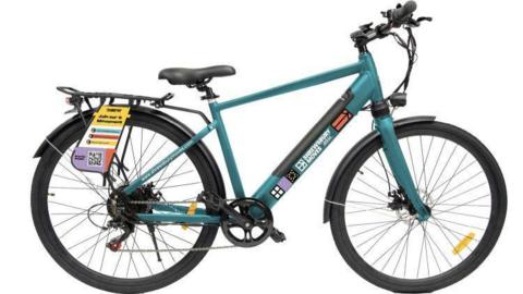 A blue e-bike which has a "Shrewsbury Moves" logo on it. On its back wheel, there is an information plaque attached, with a scannable code