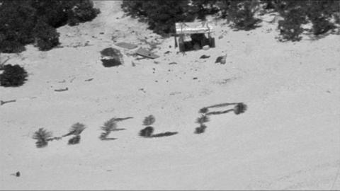 US Coast Guard photo showing the mariners' 'HELP' sign from above