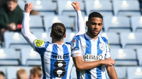 Ben Wiles celebrates his goal against Barnsley in front of the Huddersfield fans