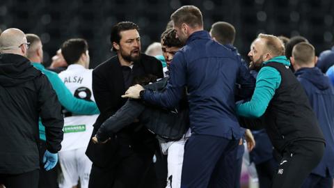 Russell Martin is among players and staff from both Swansea and Preston involved in a melee