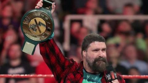 WWE Hall of Famer Mick Foley holding the all-new 24/7 Championship belt