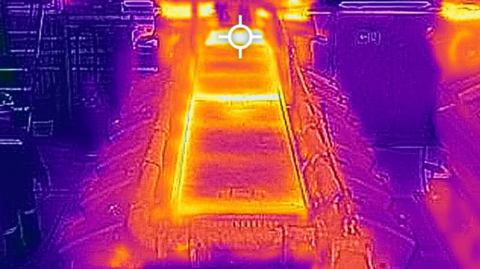 Thermographic image of a main engine on Stena Europe shows bright in the centre, with bluey/purple on the sides 
