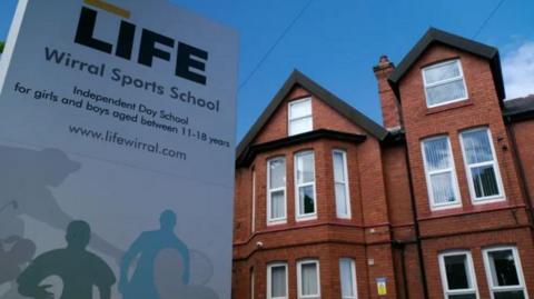 School sign outside the building reads LIFE Wirral Sports School Independent Day School for girls and boys aged between 11-18 years
It then lists its website www.lifewirral.com