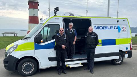 The new CCTV van with three police officers standing in front of it on Plymouth Hoe