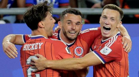John McGinn celebrates scoring for Scotland