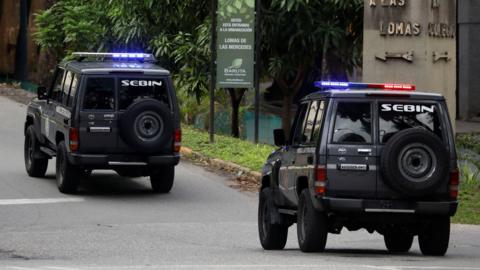 Vehicles of Bolivarian National Intelligence Service (SEBIN) outside the Argentine embassy in Caracas, where six members of the opposition sought asylum, on 7 September 2024.