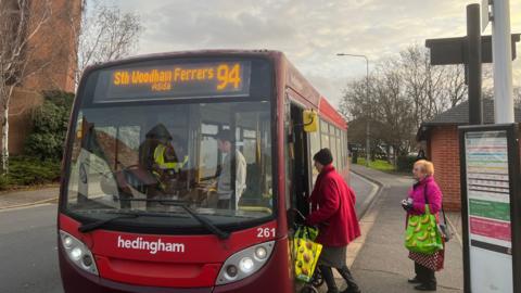 Three people getting on the 94 bus to South Woodham Ferrers