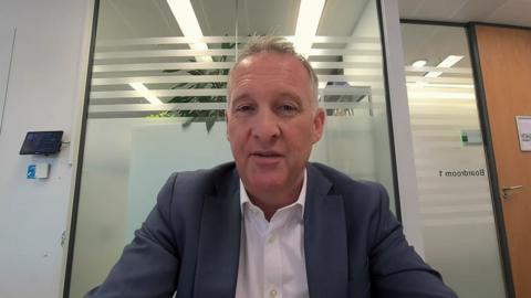 John Whitehurst, Chief Executive of Greater Thameslink Railway in a suit.