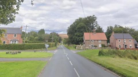 A Google Maps screenshot of the B1248 close to the junction with Station Road. It is a single-lane carriageway road with junctions either side.