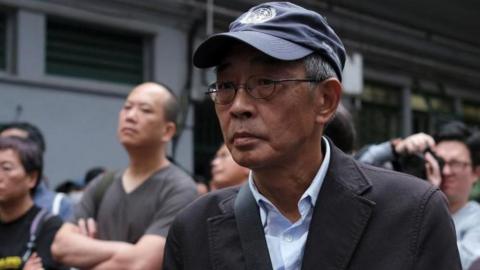 Bookseller Lam Wing-kee marches during a protest in Hong Kong to demand authorities scrap a proposed extradition bill with China. Photo: March 2019.