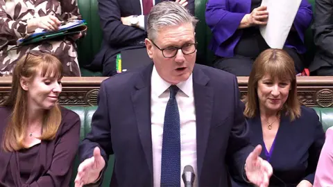 Keir Starmer speaking in the Commons with his hands held in front of him