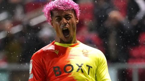 Lyle Taylor celebrates