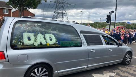 Funeral cortege passes in Castleford