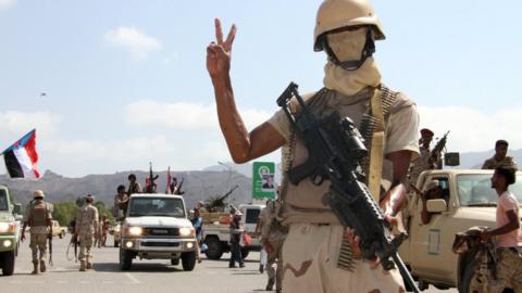 Yemeni fighter loyal to government stands guard during rally marking anniversary of south's revolt against British colonial rule in the southern city of Aden. October 13, 2016