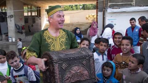 Jamie Jibberish entertaining children in Beirut