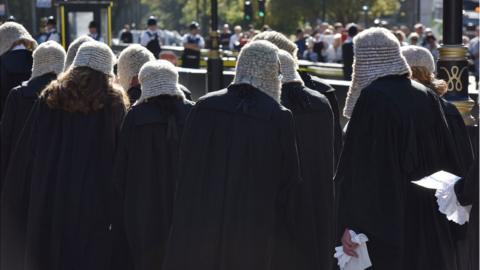 barristers in gowns and wigs