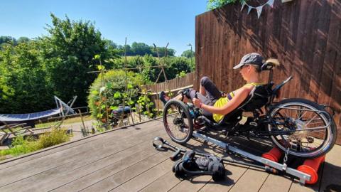 Amanda doing her cycling challenge