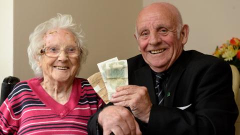 Michael Doherty and his mother Margaret with his pay packet