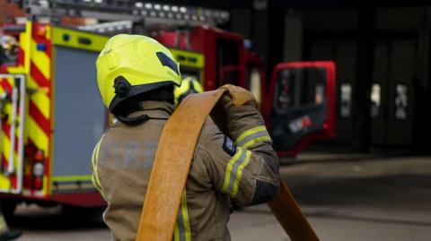 Firefighter officers running through a practice drill during a London Fire Brigade facility at Poplar Fire Station in London. 
