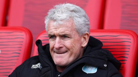 Mark Hughes sat watching a Carlisle match last season