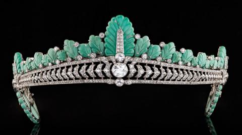 The tiara from the front showing the turquoise plumage and large diamond at the centre. 