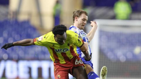 Watford's Nestory Irankunda and Sheffield Wednesday's Cole McGhee battling for the ball