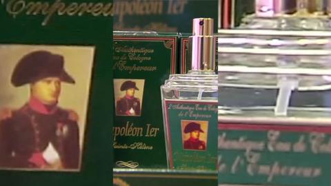 Image of a green perfume bottle with a picture of Napoleon on the front