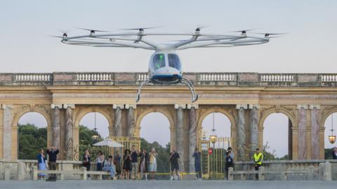 Resembling a large drone, the two-seater VoloCity aircraft takes off at the Palace of Versaille