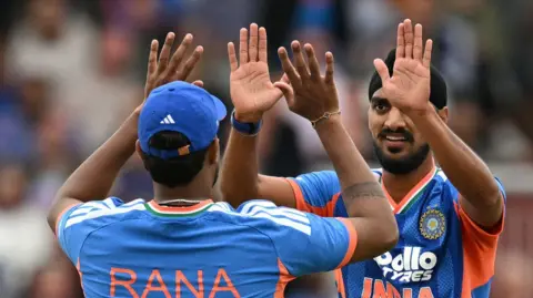 India players celebrate a wicket
