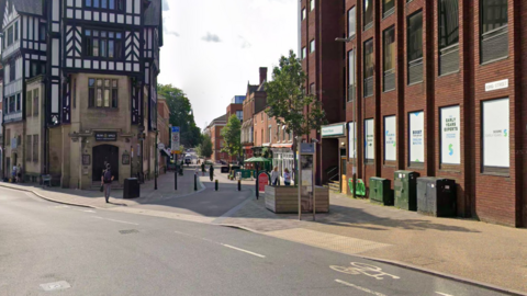 A Google Street View photograph of a road with offices on either side of the pavement where the incident is alleged to have happened.
