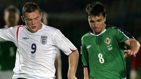 England's Wayne Rooney in action against Northern Ireland's Damien Johnston