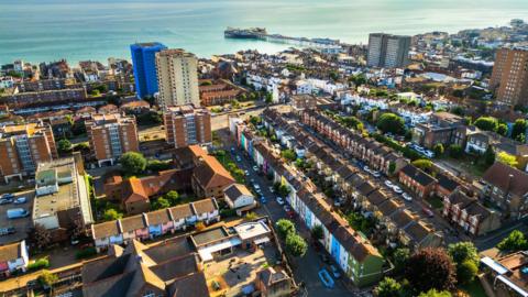 Aerial view, taken by drone, depicting the architecture and housing of Brighton in East Sussex, UK on a sunny summer day.