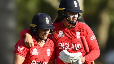 England's Sophie Ecclestone (right) puts her arm round team-mate Katherine Sciver-Brunt (left) as they walk off after beating Ireland