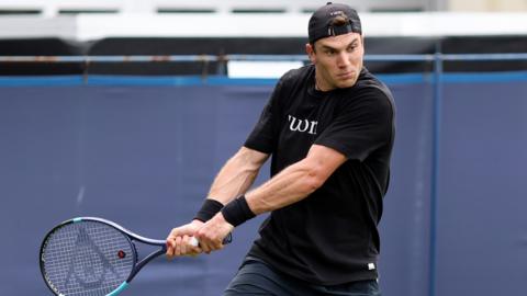Jack Draper hits a backhand in a practice session at Eastbourne
