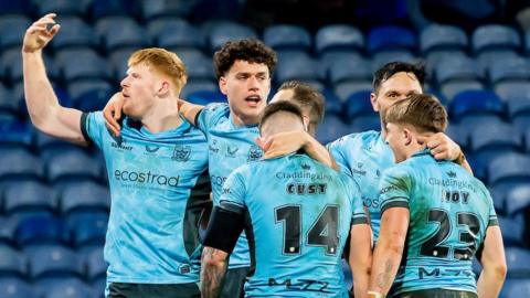 Hull FC player Harvey Barron (left) celebrates his try against Huddersfield Giants 