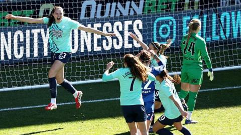 Isobel Goodwin celebrates after scoring for London City Lionesses against Chelsea in the Women's Super League