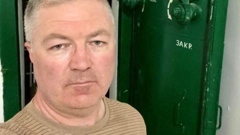 Paul Hands at the entrance of an air raid shelter in Kyiv.