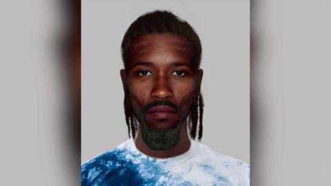 The e-fit image shows a black man with a goatee beard and black, shoulder length hair. He has brown eyes and is wearing a blue and white top. 