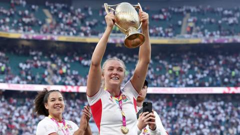 Zoe Stratford lifts the World Cup for England in 2025