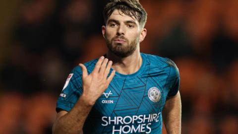 Tom Bloxham celebrates scoring for Shrewsbury against Blackpool