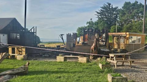 The View Coffee Shop is reduced to a burnt out wooden chalet