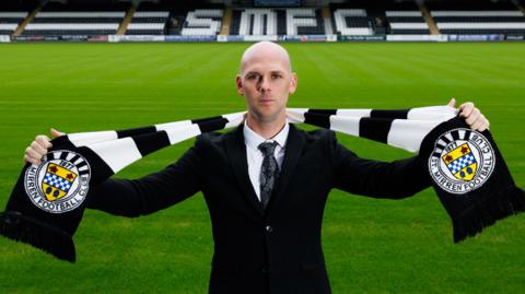 Craig McLeish poses with a St Mirren scarf