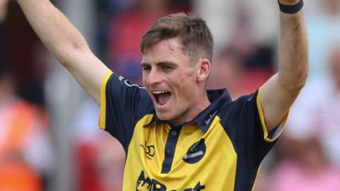 Andy Gorvin of Glamorgan celebrates as he takes the wicket