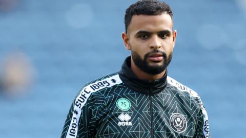 Anis Ben Slimane warming up with Sheffield United